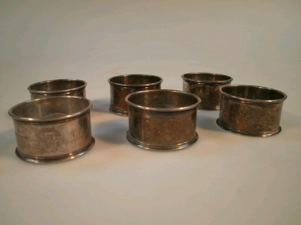 Appraisal: A set of six chased silver napkin rings monogrammed GR