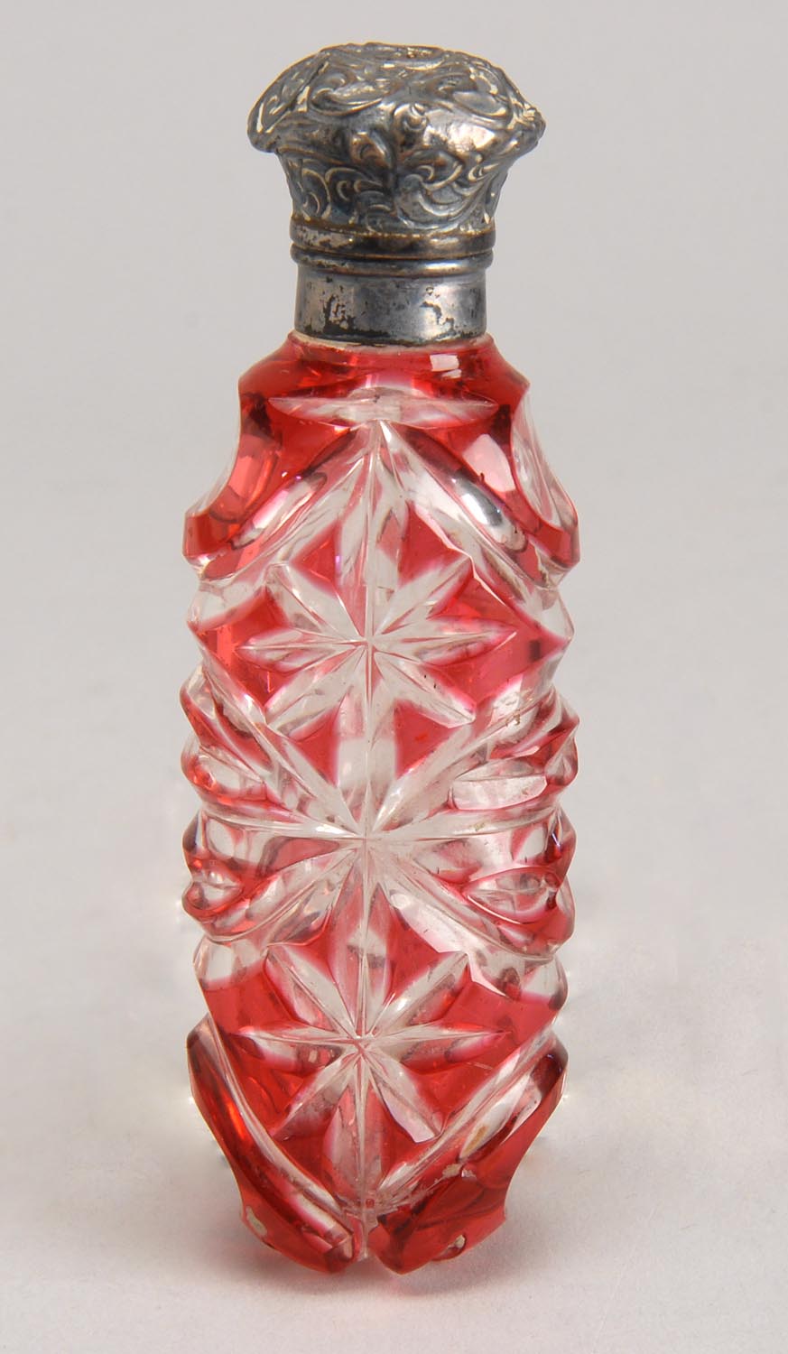 Appraisal: TH CENTURY ENGLISH CUT OVERLAY GLASS SCENT BOTTLE in cranberry