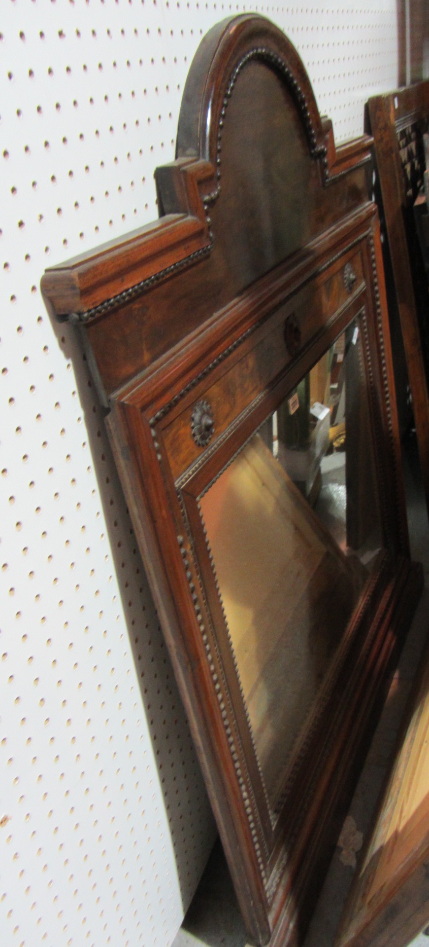 Appraisal: A th century mahogany over mantel mirror with an arched