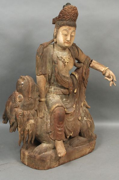 Appraisal: Old Chinese carved and painted wood Quan Yin sitting on