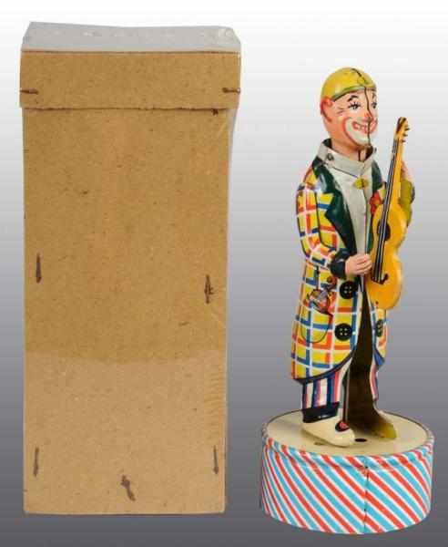 Appraisal: Tin Distler Guitar Player Wind-Up Toy Description German Working Nice