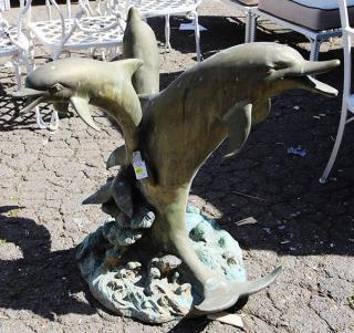 Appraisal: Dolphin sculpture executed in patinated metal having a copper finish