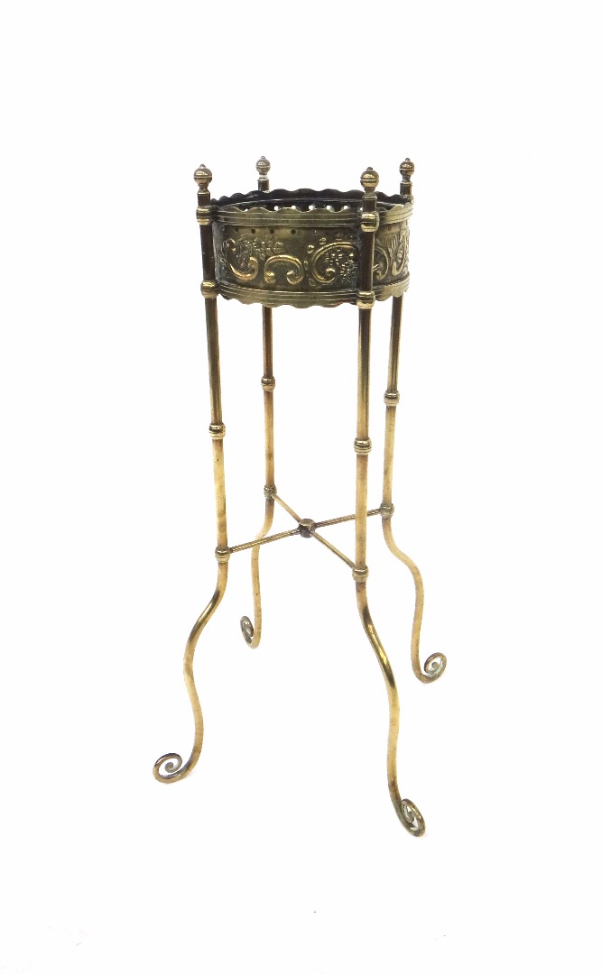 Appraisal: An Aestethic period circular brass kettle stand with foliate and