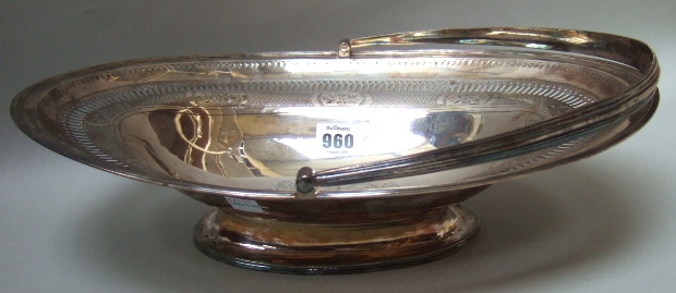 Appraisal: A George III silver oval cake basket engraved with a