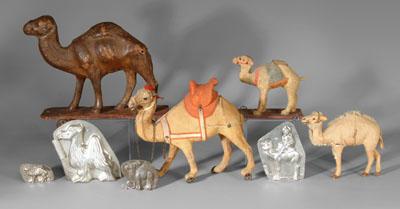 Appraisal: Four camel pull toys four molds four hinged metal camel