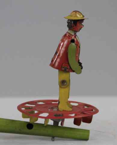 Appraisal: DANCING MAN PENNY TOY WHISTLE Attributed to Distler lithographed tin