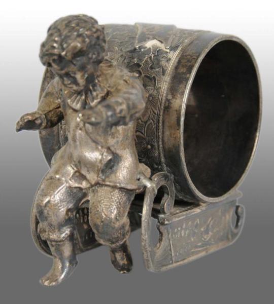 Appraisal: Boy Pulls Sled Figural Napkin Ring Description Marked Wilcox Silverplate