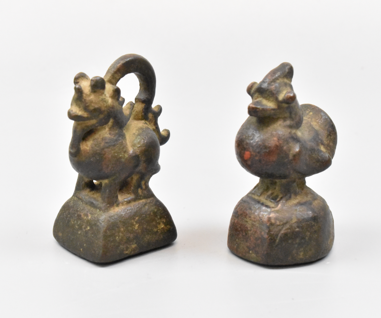 Appraisal: Two Chinese bronze paper weights One shaped as a duck