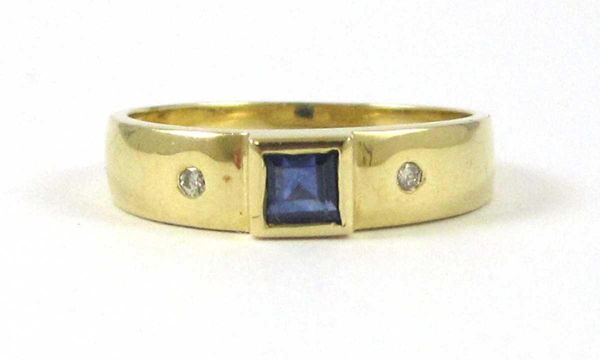 Appraisal: SAPPHIRE DIAMOND AND FOURTEEN KARAT GOLD RING with a round-cut