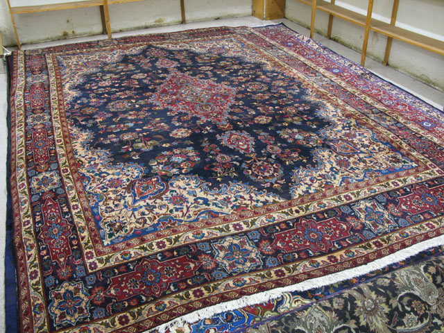 Appraisal: SIGNED PERSIAN KASHAN CARPET floral and central floral medallion design