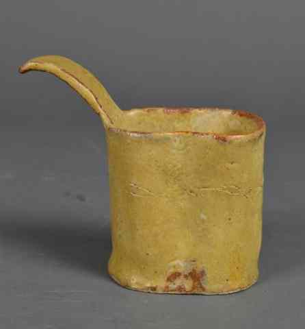 Appraisal: An Unusual Early th Century Pottery CupWith long handle and