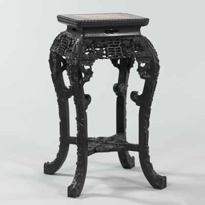 Appraisal: A Chinese Carved Wood Stand with Marble Inset Top Elaborately