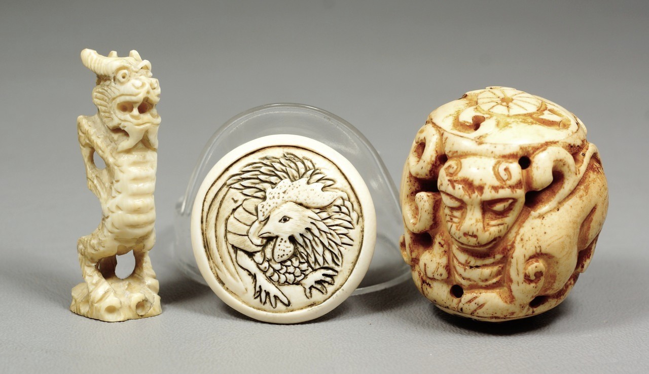 Appraisal: carved ivory Japanese netsuke disc with dragon standing dragon foo