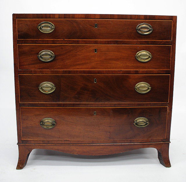 Appraisal: A GEORGE III MAHOGANY STRAIGHT FRONT CHEST of four long