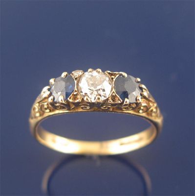 Appraisal: A diamond and sapphire three stone ring the circular cut