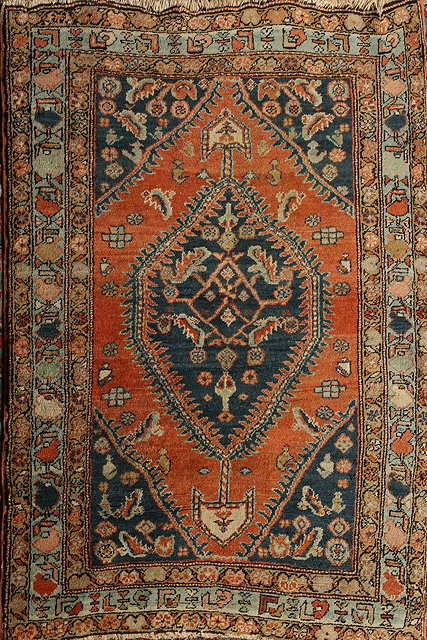 Appraisal: AN ANTIQUE PERSIAN HERIZ RUG with central medallion on a