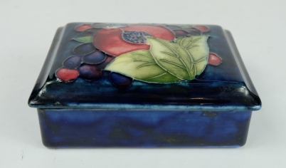 Appraisal: Moorcroft oblong box cover decorated in the pomegranate design