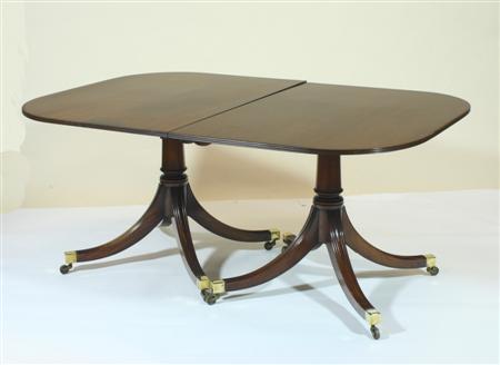 Appraisal: A Regency style mahogany dining table the rounded rectangular top