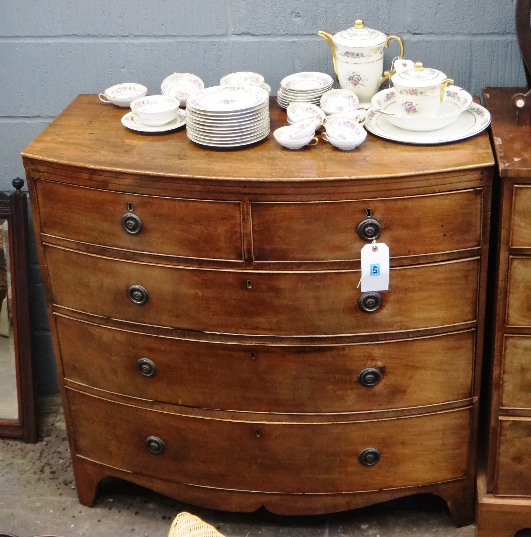 Appraisal: A George III mahogany bow fronted chest fitted with two