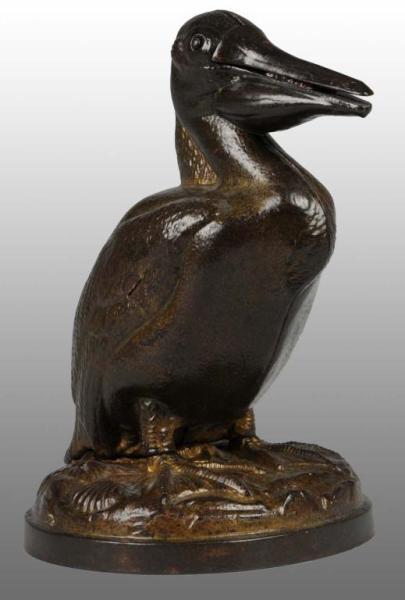 Appraisal: Cast Iron Pelican with Mammy Mechanical Bank Description Manufactured by