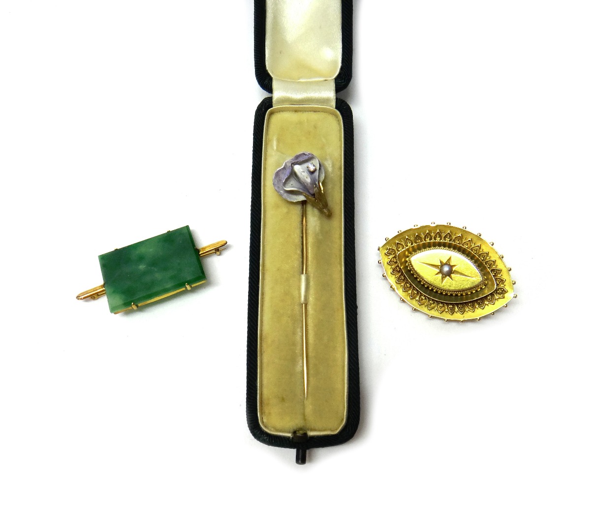 Appraisal: A diamond set and mauve enamelled stick pin with a