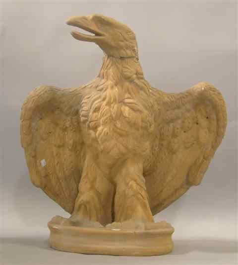 Appraisal: TERRA COTTA EAGLE on circular base with outstretched wings and