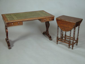 Appraisal: A Victorian mahogany writing table the gilt tooled green leather