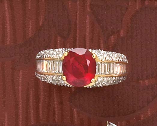 Appraisal: RUBY AND DIAMOND RING k yellow gold ring set with