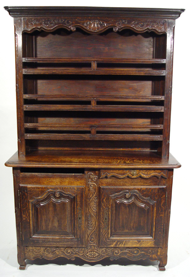 Appraisal: Oak dresser the carved cornice above three open plate racks