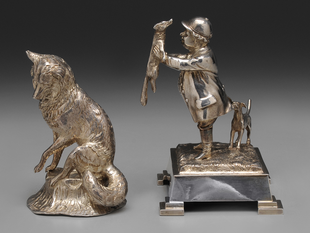 Appraisal: Two English Silver Fox Figures gentleman holding a fox with