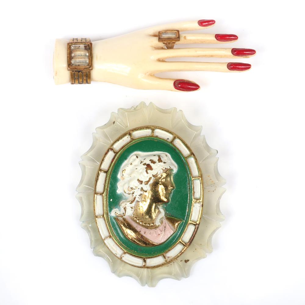 Appraisal: TWO VINTAGE RETRO CELLULOID PINS ART DECO GLAMOUR HAND WITH