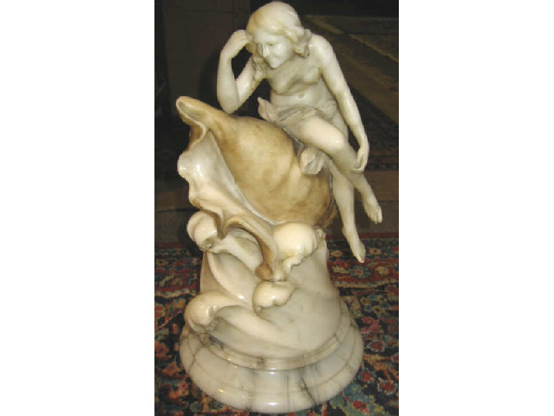 Appraisal: ITALIAN MARBLE FIGURE GROUP Showing a woman atop a wave