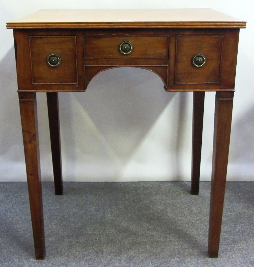 Appraisal: A George III mahogany lowboy with three frieze drawers on