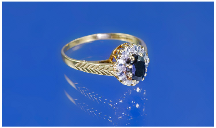 Appraisal: Carat Gold Diamond Cluster Ring Set with a central sapphire