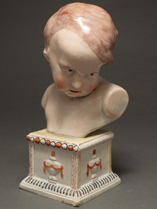 Appraisal: Staffordshire earthenware bust of a child Ralph or Enoch Wood