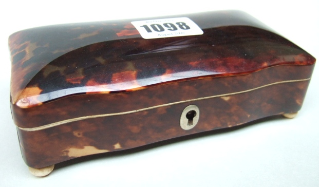 Appraisal: A tortoiseshell shaped rectangular trinket box raised on four bun