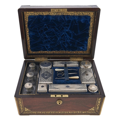 Appraisal: A Victorian brass inlaid and silver fitted rosewood dressing case