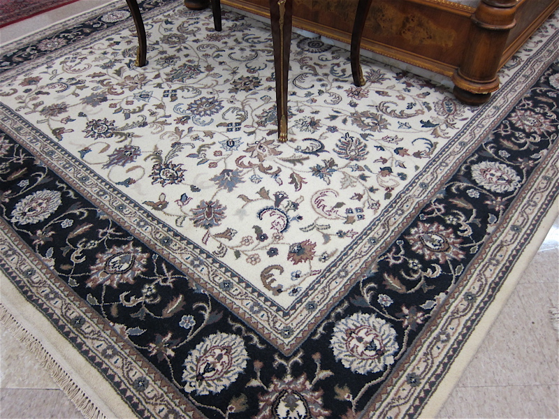 Appraisal: HAND KNOTTED ORIENTAL CARPET Indo-Persian Isfahan floral design on cream