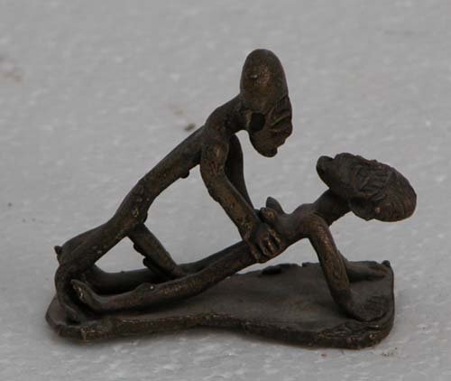 Appraisal: Small Sculpture of Copulating Man and Woman bronze sculpture on