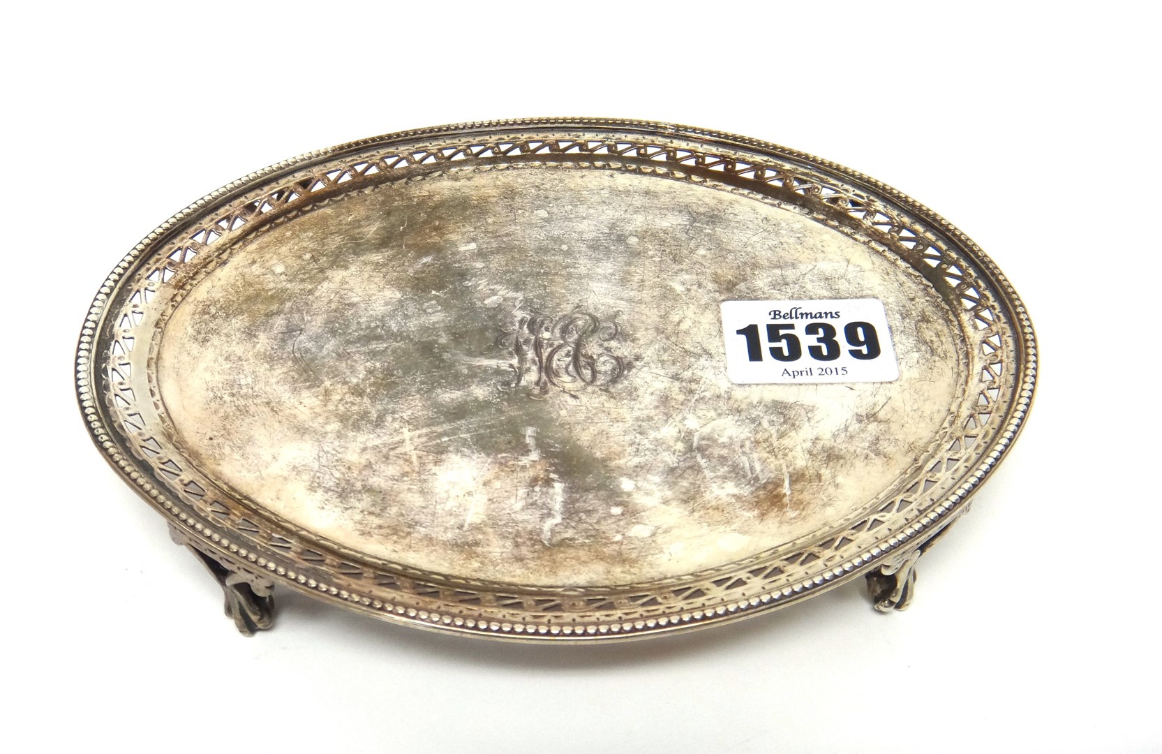 Appraisal: A George III silver oval teapot stand decorated with a