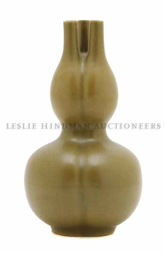 Appraisal: A Chinese Teadust Glazed Vase of globular form issuing three