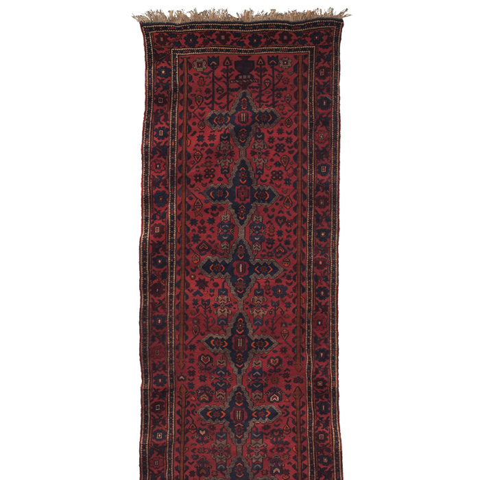 Appraisal: Caucasian runner c stylized floral design on a red field