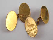 Appraisal: A pair of carat gold cufflinks with engraved crests approx