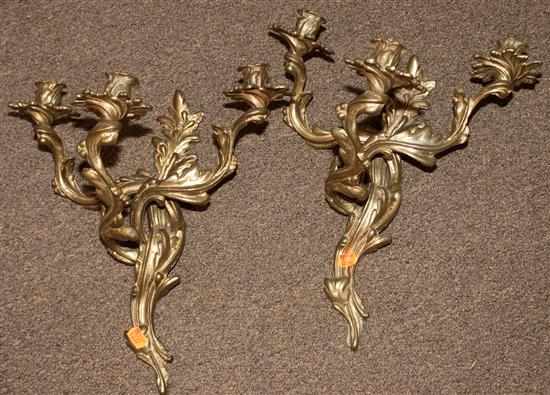 Appraisal: Pair of Rococo style brass three-light sconces Estimate - All