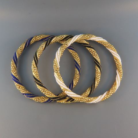 Appraisal: Gold-filled Bangle Bracelets twisted wrap each with different color beadwork