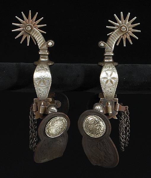 Appraisal: A pair of double-mounted and silver inlaid California style spurs