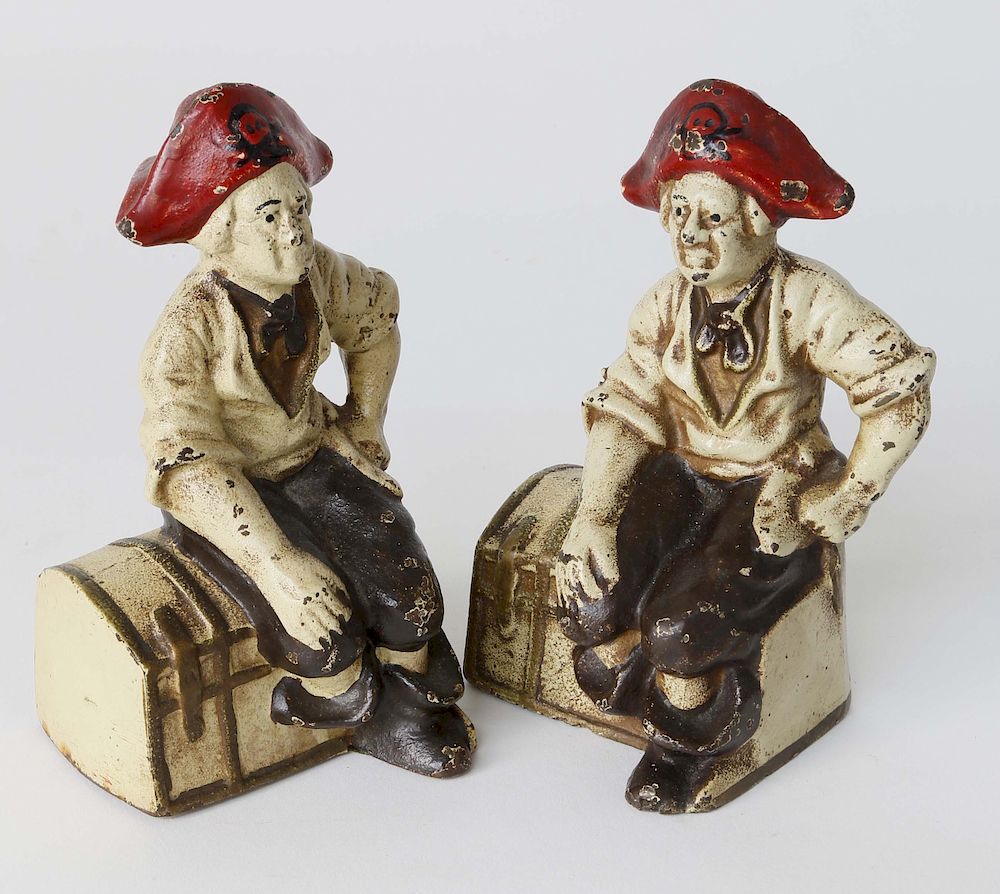 Appraisal: Pair of Vintage Cast Iron Polychrome Pirates Sitting on Treasure