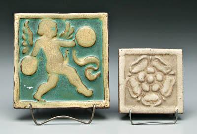 Appraisal: Two Grueby tiles putto playing cymbals on varying green ground