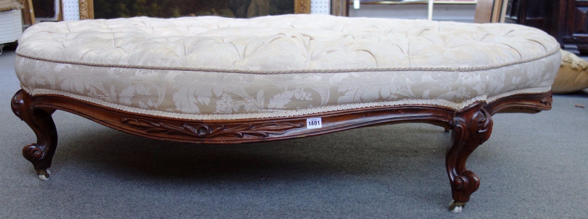 Appraisal: A large Victorian rosewood framed foot stool of shaped oval