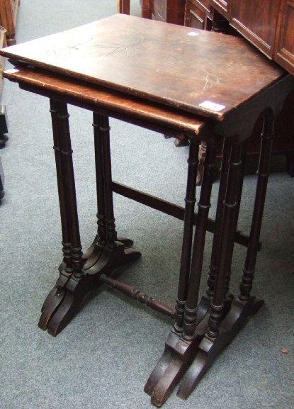 Appraisal: A nest of three stained beech tables with rectangular tops